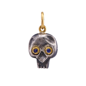 
            
                Load image into Gallery viewer, Front-facing view of Blue Sapphire Skull Charm by Prehistoric Works.
            
        