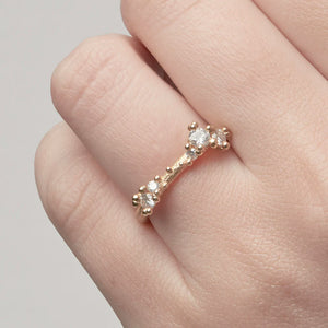 
            
                Load image into Gallery viewer, Detail view of model wearing Asymmetrical Diamond Band with Granules by Ruth Tomlinson on left ring finger
            
        