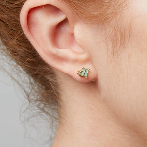 
            
                Load image into Gallery viewer, Detail view of model wearing Raw Emerald and Diamond Encrusted Stud Earring by Ruth Tomlinson in right ear.
            
        