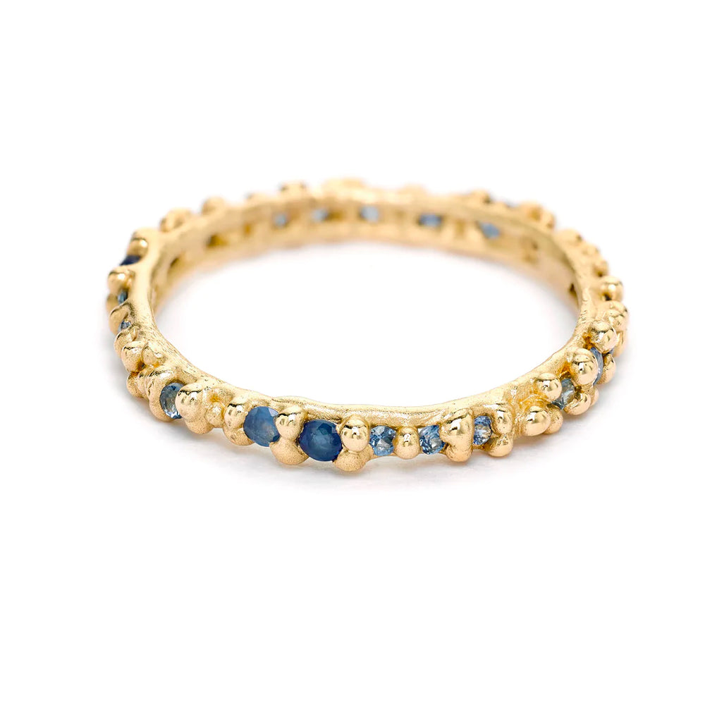 
            
                Load image into Gallery viewer, Angled view of Blue Sapphire Granule Eternity Band by Ruth Tomlinson
            
        