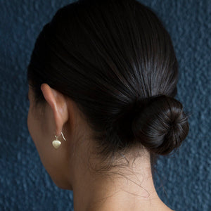 
            
                Load image into Gallery viewer, Rear view of model wearing Ravan Drop Earrings by Dan-Yell on left ear.
            
        