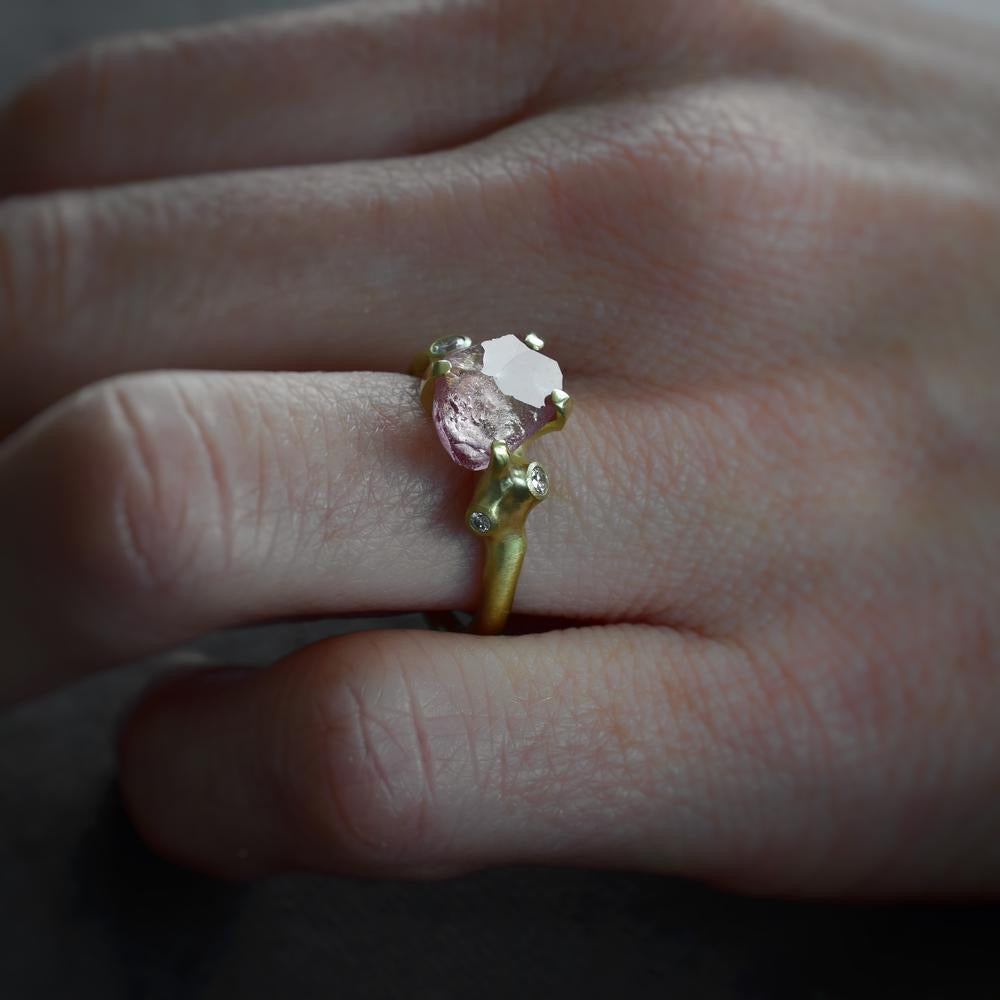 
            
                Load image into Gallery viewer, Close up view of model wearing Rough Luxe Pink Garnet Ring by Johnny Ninos on left hand.
            
        