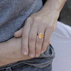 Elysian Signet Ring by Polly Wales on model's left hand.