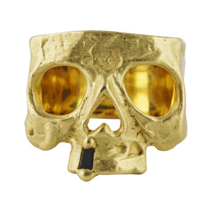 Front-facing view of 18k yellow gold Snaggletooth Skull Ring w/ Black Diamond by Polly Wales.